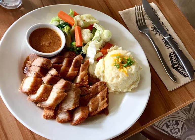 Pork. mashed potato, and vegetables from Cafe Del Mar