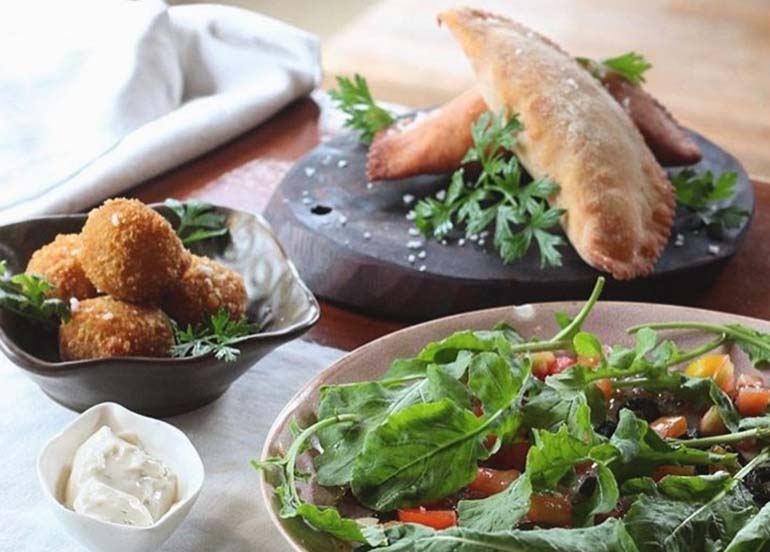 Empanada, Potato Balls, and Salad from La Carinderia