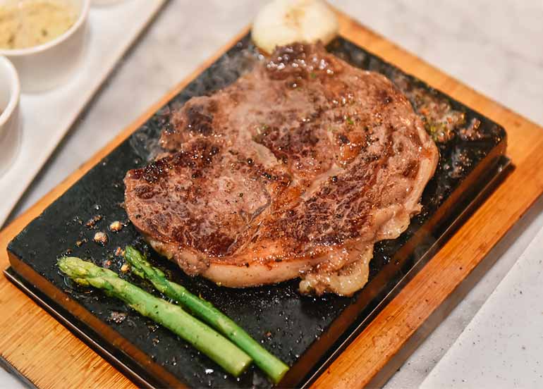 steak-cooking-on-a-stone