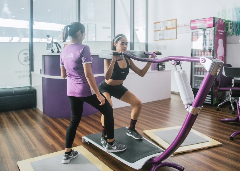 Woman Exercise with Trainer