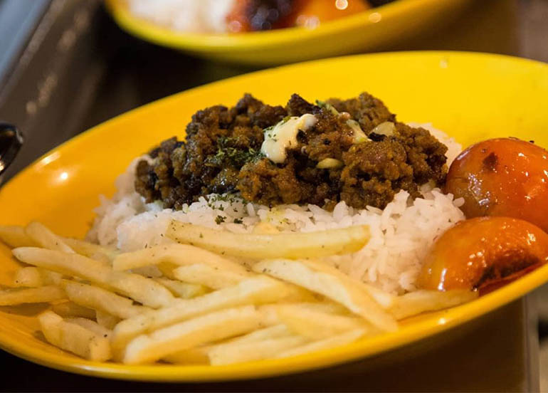 Keema Meal (marinated beef over rice, french fries, grilled tomatoes) from Kebab Bob