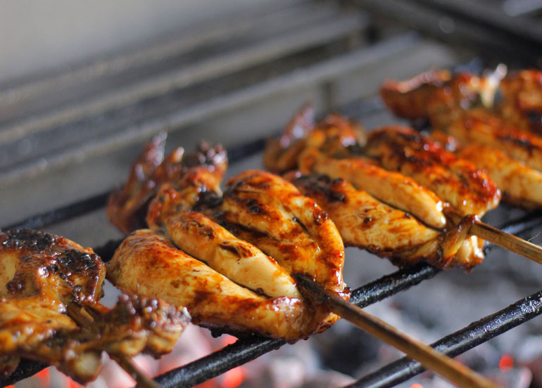 Bai Sinugbang Manok laid on a grill