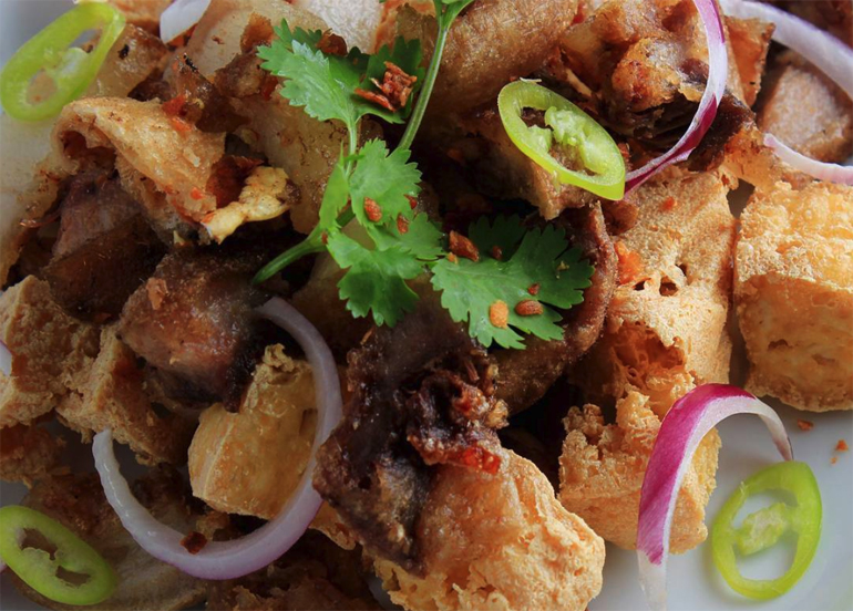Tokwa't Baboy topped with cilantro, chili, and onion from Tipulo Filipino
