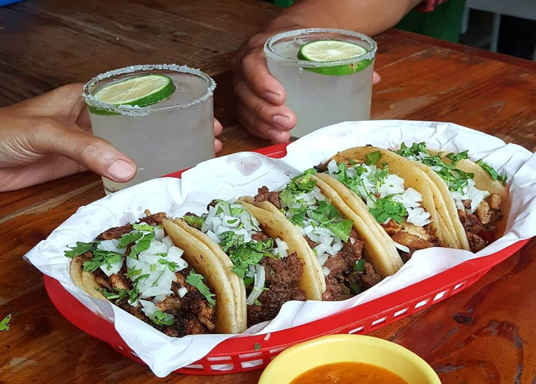 El Chupacabra tacos with cocktails on the side