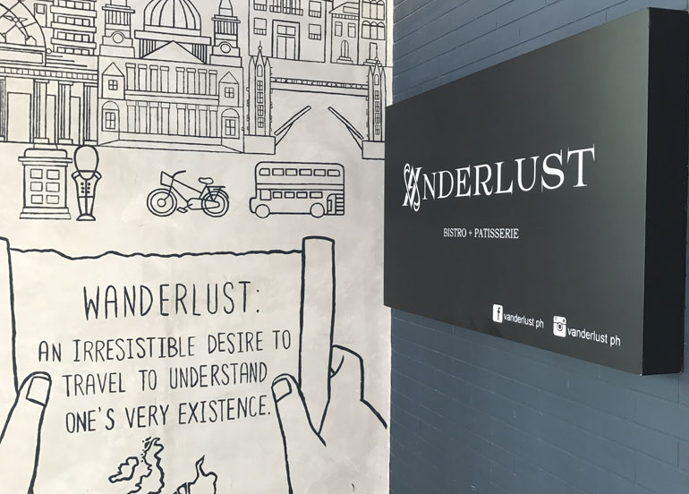 Vanderlust exterior with sign and mural art