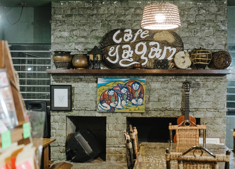 Cafe Yagam Interior with paintings, cordilleran pots, and their signage