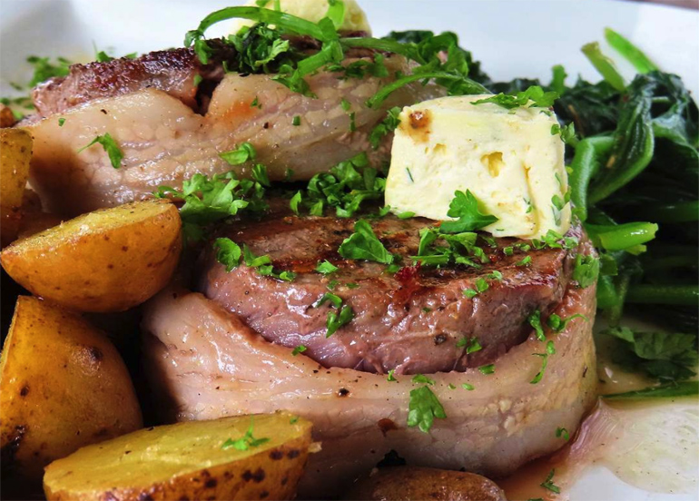 steak from cafe by the ruins with a side of potatoes, butter, and herbs