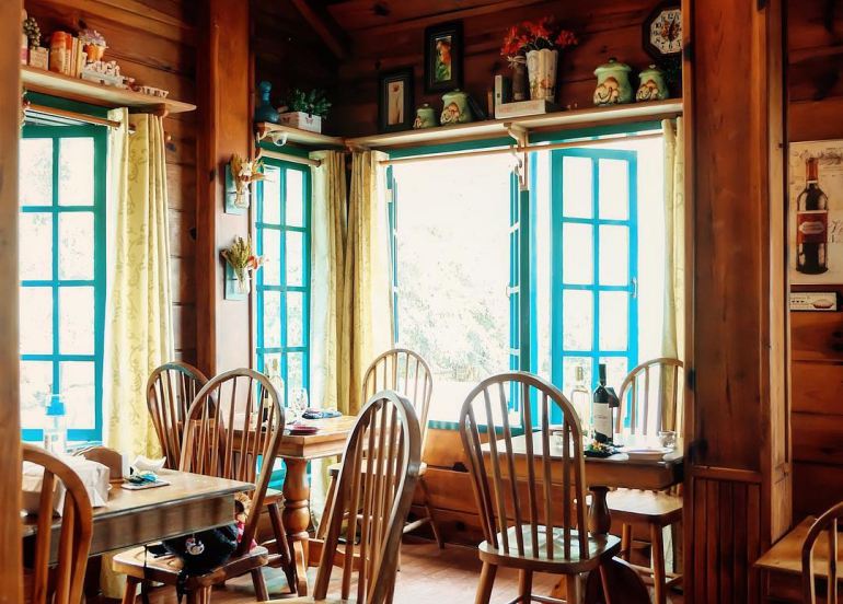 Forest House Interior with wooden chairs