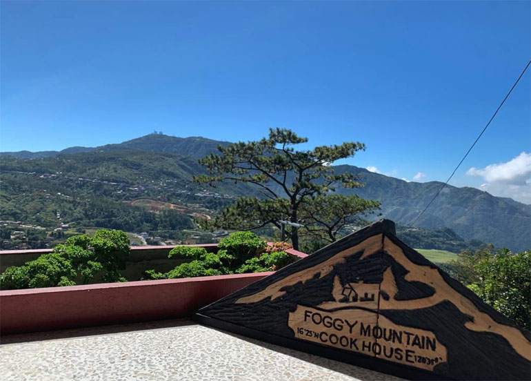 Foggy Mountain Cookhouse Logo with a view of mountains