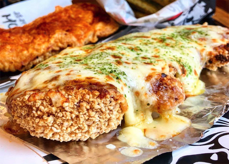 Crispy and Crunchy Monga Chicken with melty mozzarella cheese on top