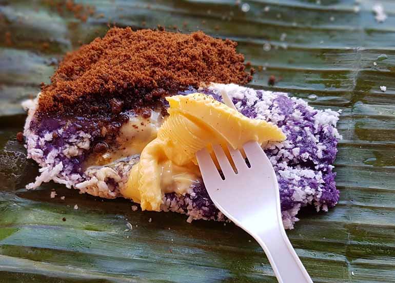 Puto Bumbong from Solibao Restaurant topped with desiccated coconut and butter
