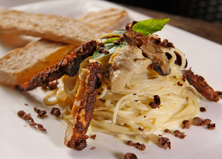 Xocolat Chicken Pasta topped with cocoa-rubbed chicken and cocoa shavings