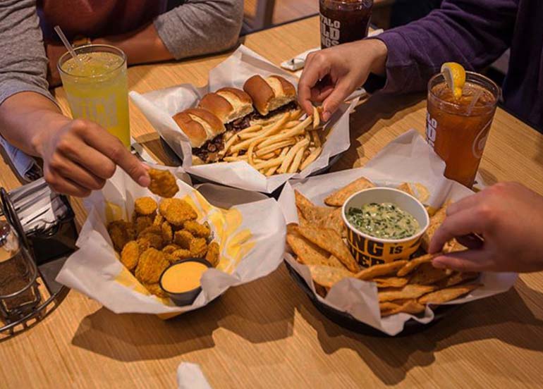 Chicken Nuggets, Spinach and Artichoke Dip, Burgers and Fries, and Iced Tea from Buffalo Wild Wings