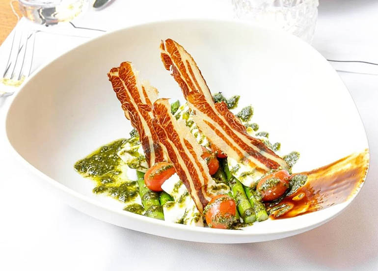 Ensalada de Burrata with Grilled Asparagus, pancetta, cherry tomatoes, and basil dressing