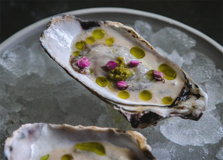 12/10 Oyster topped with olive oil and edible flowers